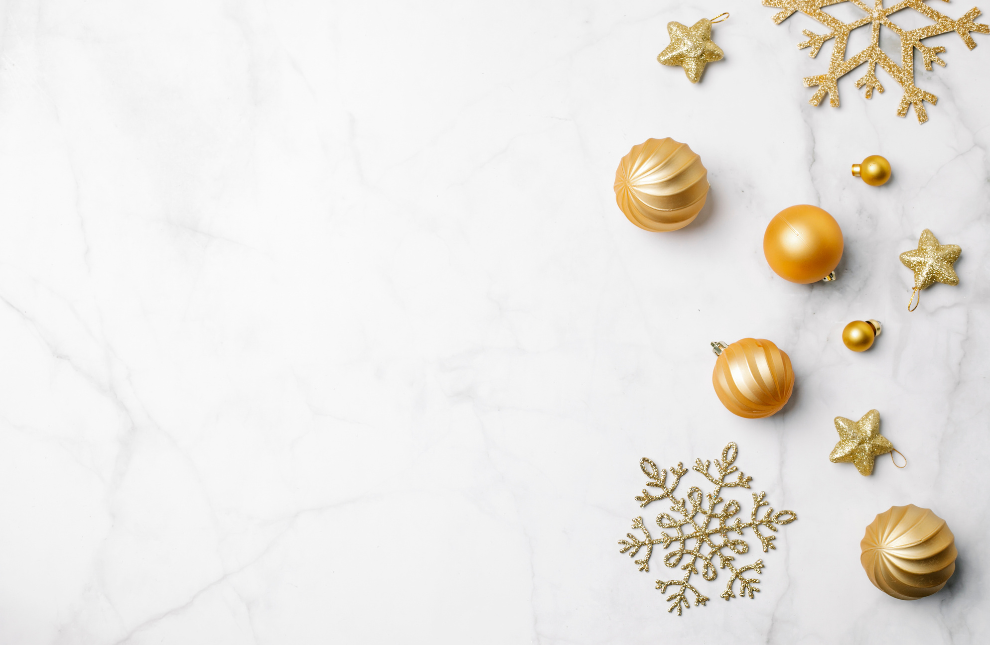 Christmas decorations placed on marble surface